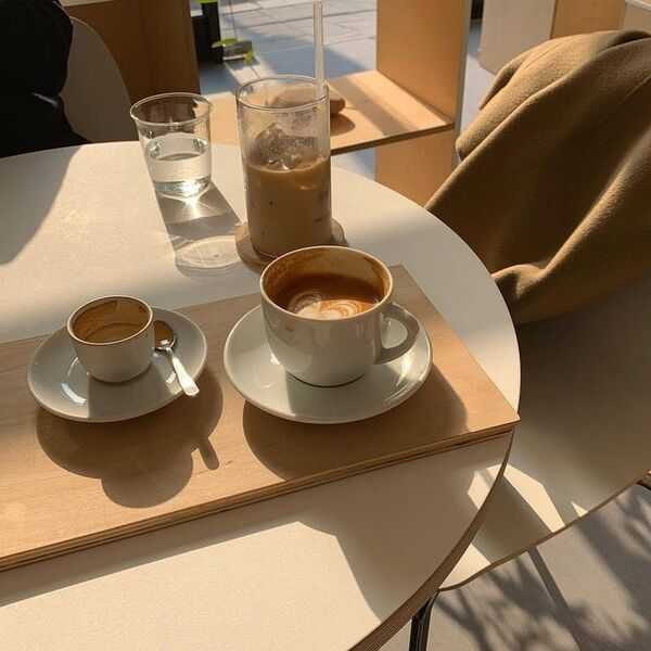 A warm cup on a table in soft light, suggesting a quiet pause